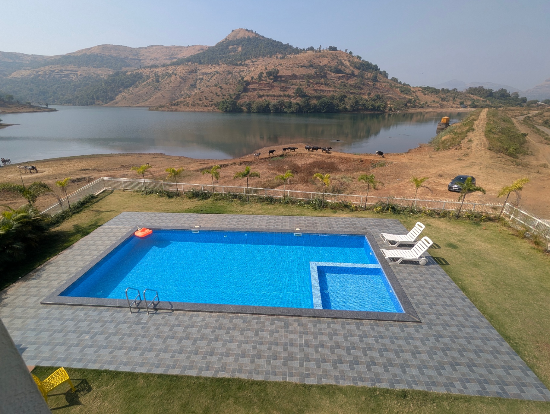 Pool contractor — Lakefront villa swimming pool with mountain views by Dreamz Pools