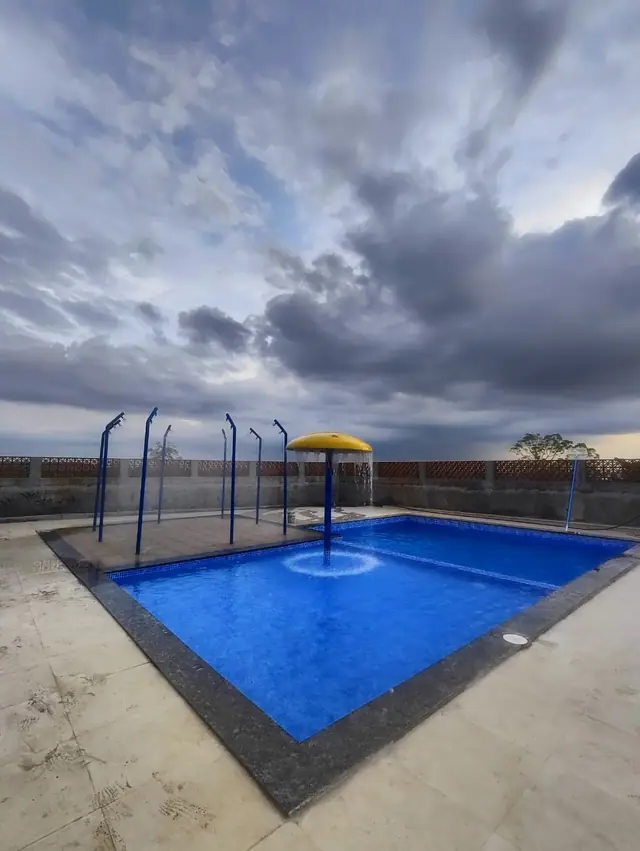Pool contractor — Rooftop pool with mushroom shower feature