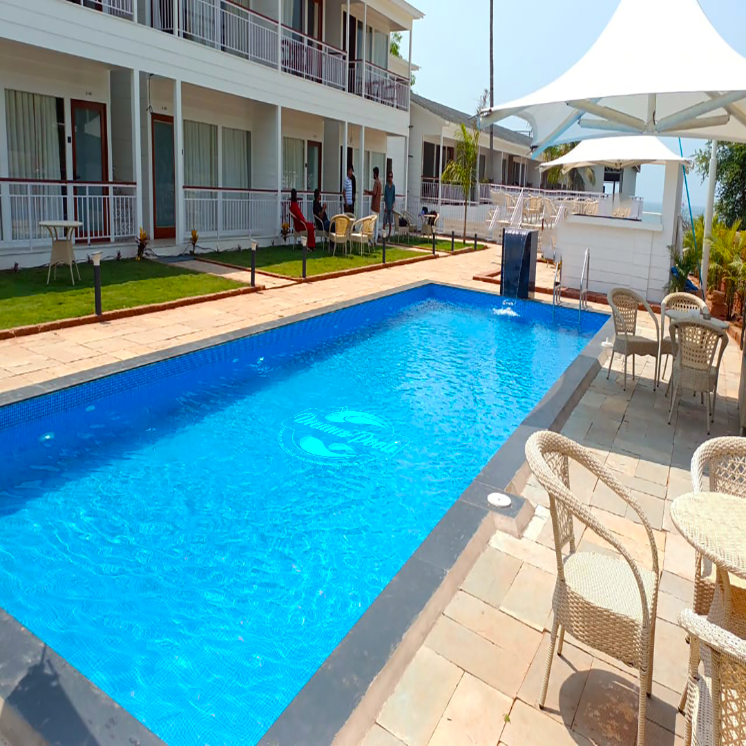 Pool contractor — Resort courtyard swimming pool with water feature by Dreamz Pools