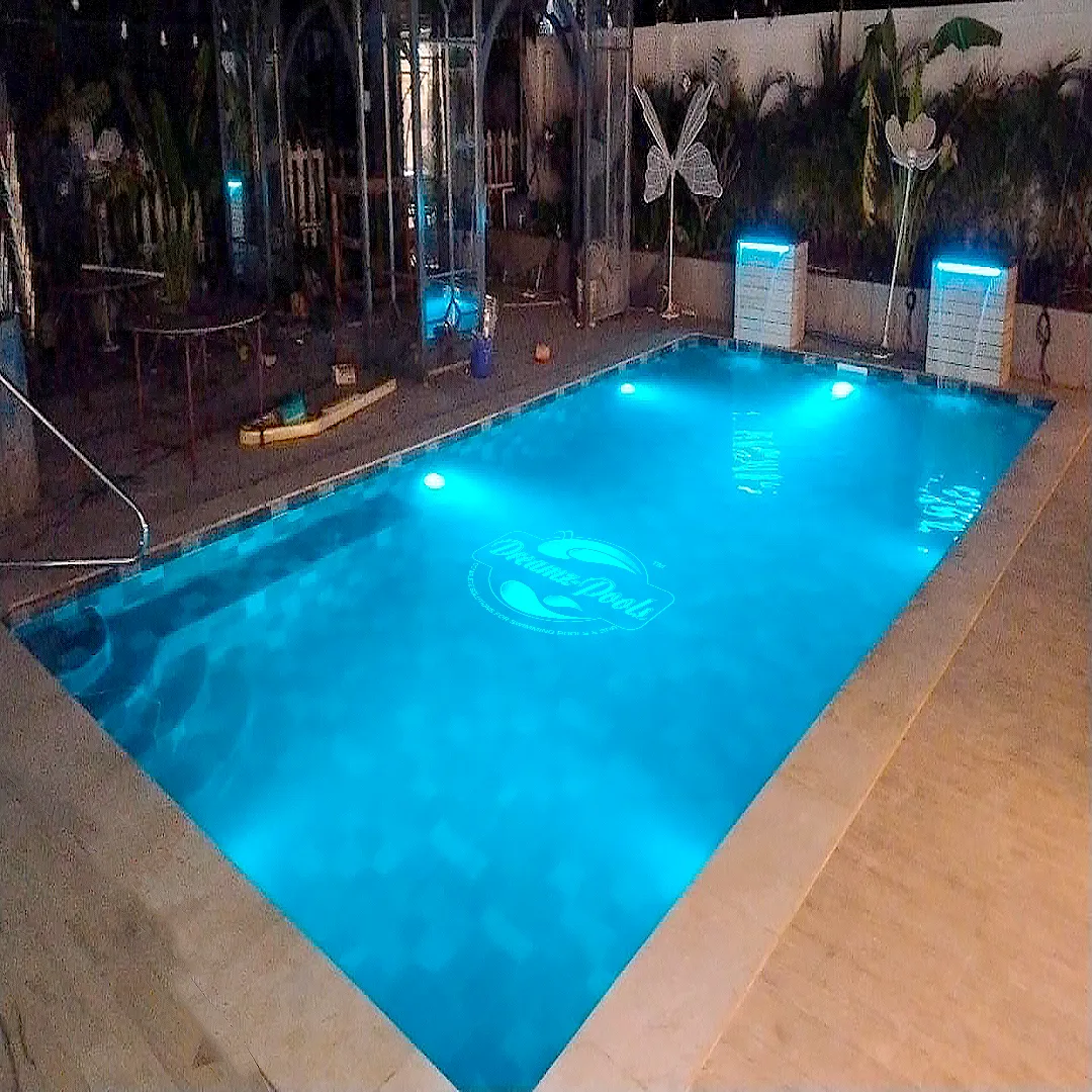 Pool contractor — Night-lit mosaic pool with LED illumination by Dreamz Pools